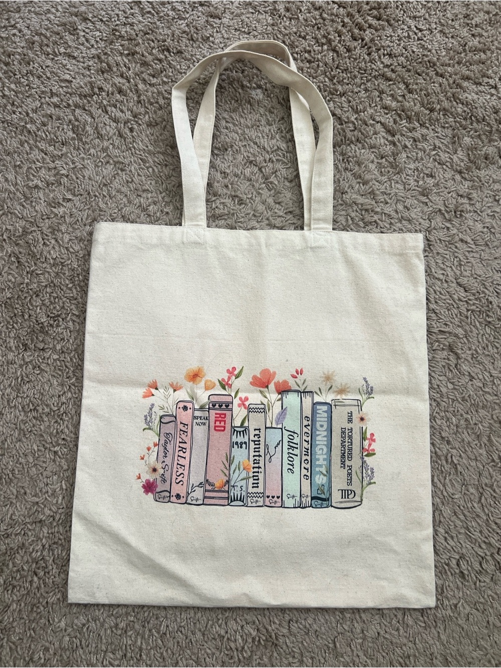 Amazon Cream Canvas Tote with Colorful Book Spine Print of Taylor Swifts Eras